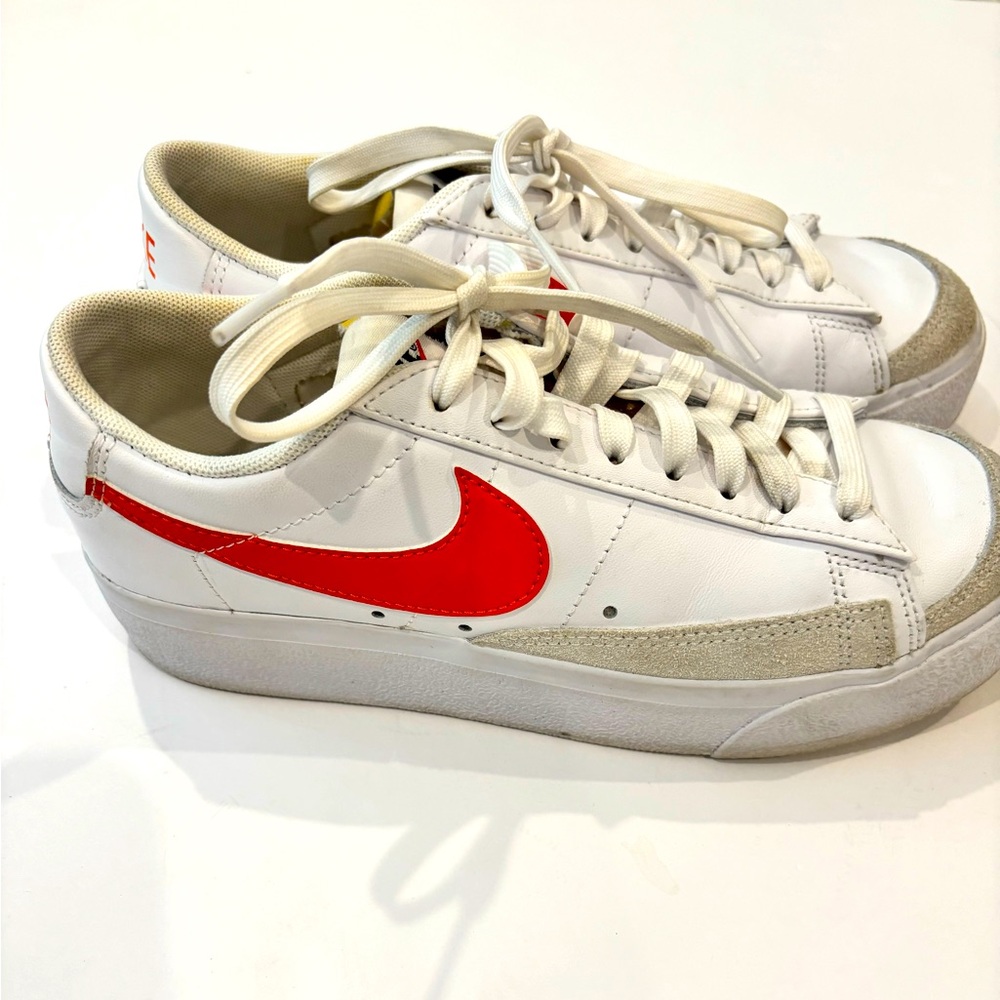 Nike blazer low platform, tennis shoes. Orange and white.